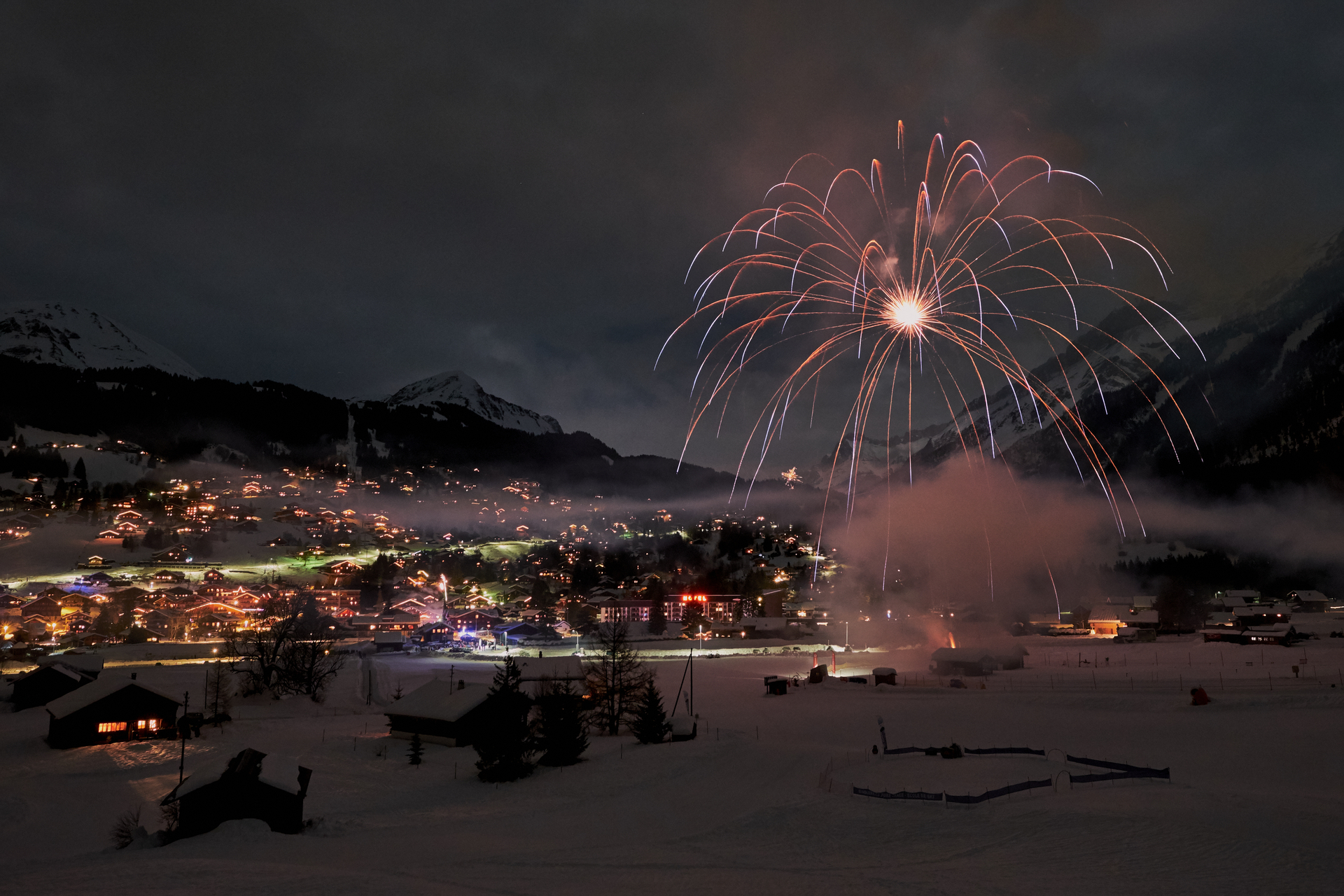 Fireworks light up the village and the valley floor