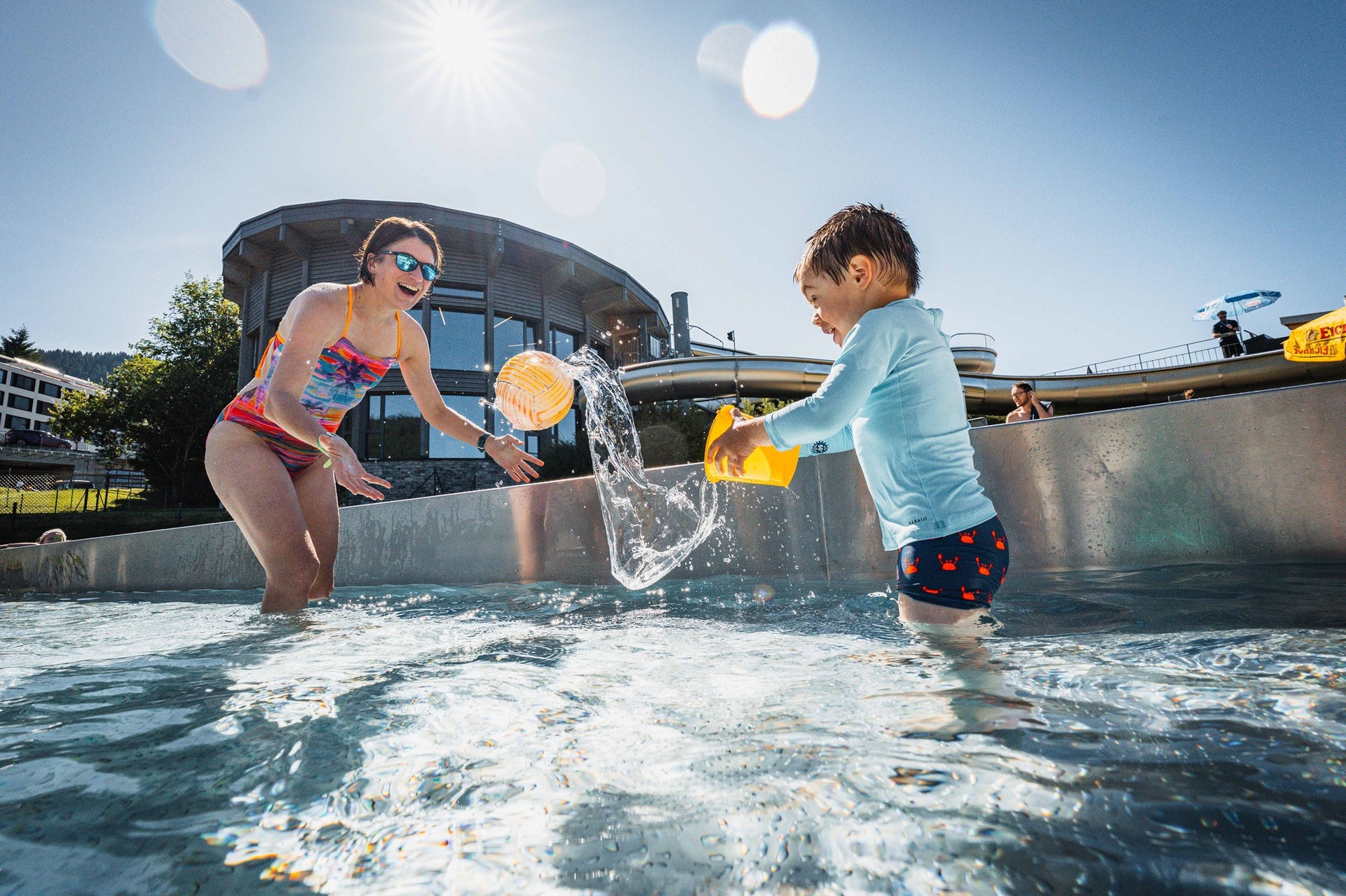 Family fun in the outdoor paddling pool at Villars