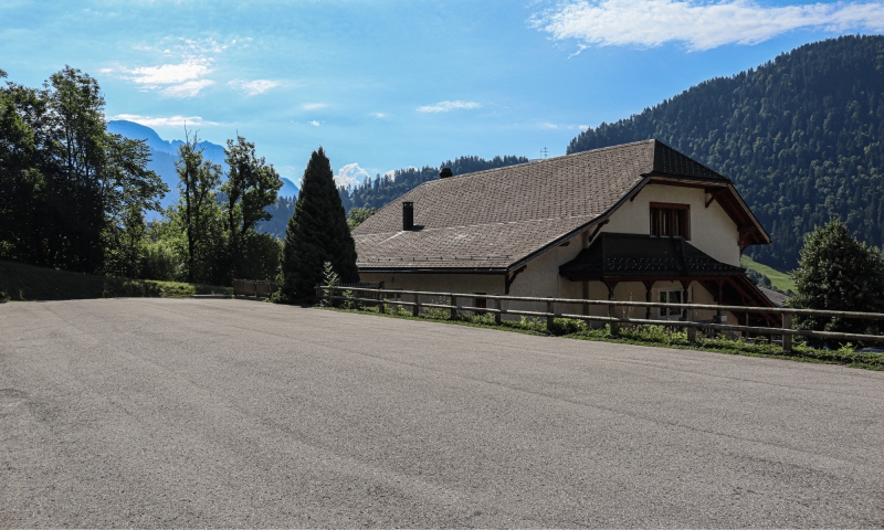 View on the parking of the communal building Rossinière summer -