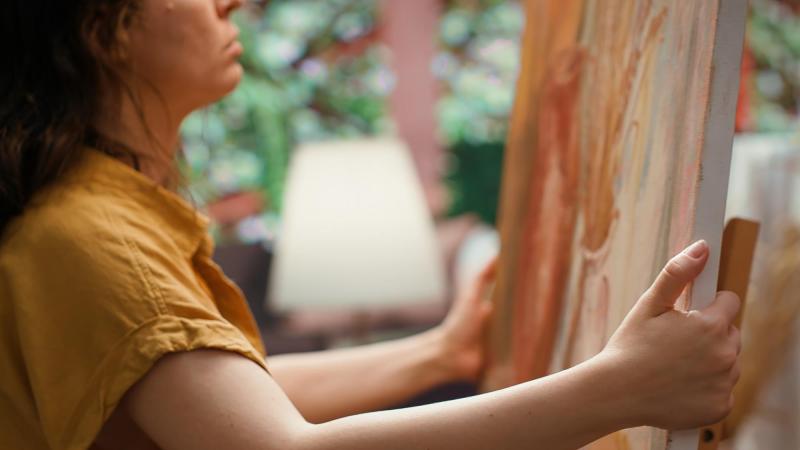 Woman holding a painting