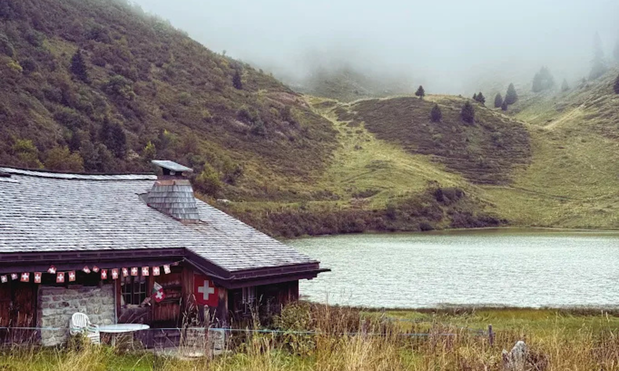 Under a low, misty sky, Lake Bretaye