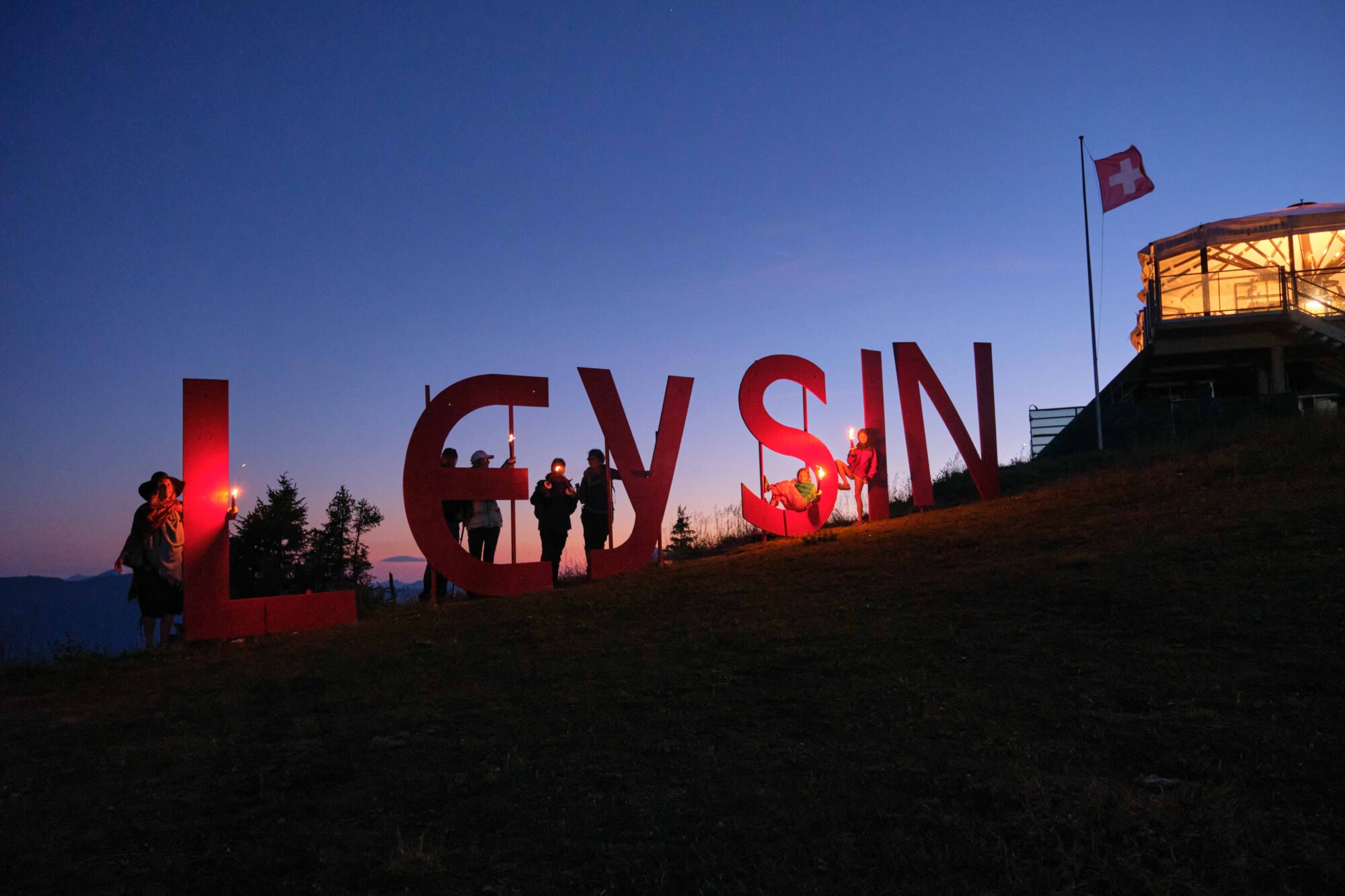 Secret of the Hamlet of Aï - Kuklos lettering at night - summer