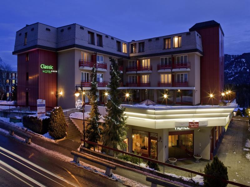 Alpine Classic Hotel by night - winter - Leysin