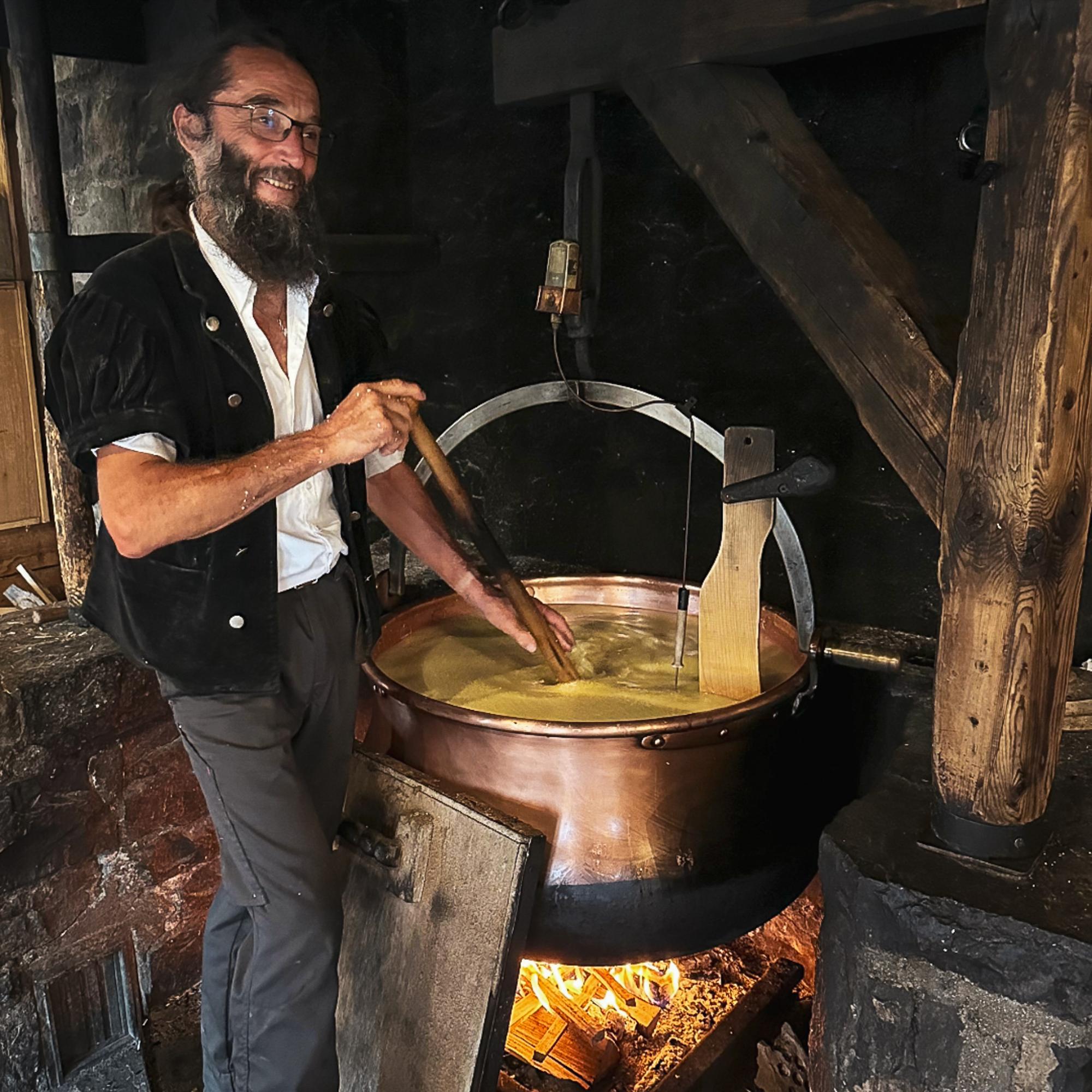 The cheesemaker, who stirs the milk continuously for 50 minutes