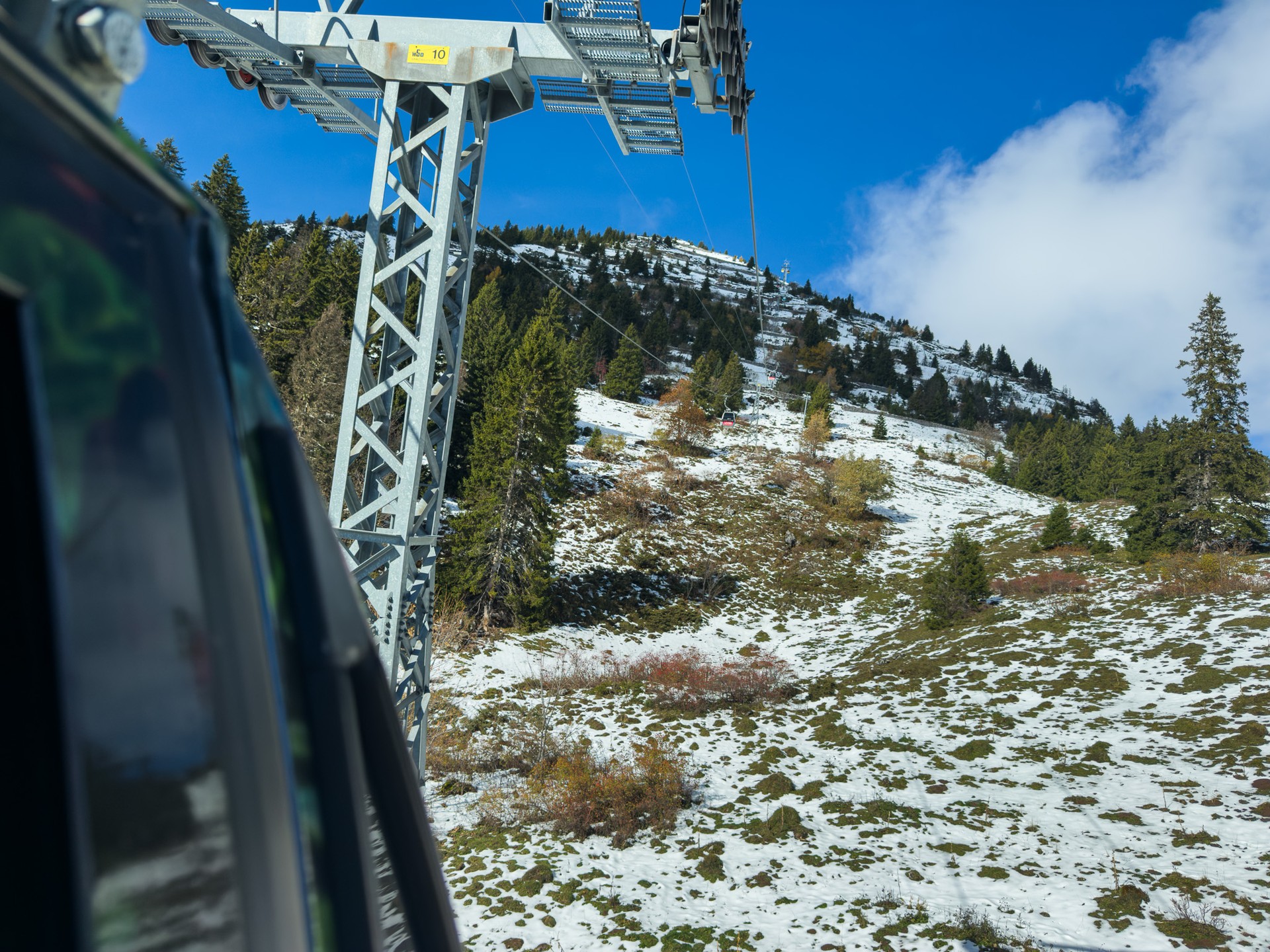 The snow-covered landscape is revealed